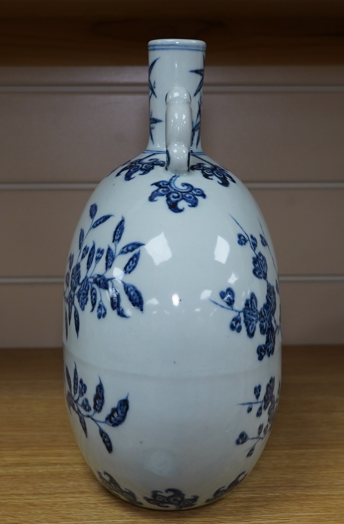 A Chinese blue and white two handled moon flask, decorated with birds on on branches, 29cm high. Condition - good